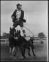 Photograph: [Photograph of Rodeo Clown Riding Mules]