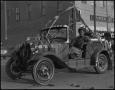Primary view of [Photograph of a Car in a Rodeo Parade]
