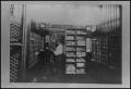 Photograph: [Photograph of Rowland H. Andruss Sorting Mail]