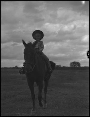 Primary view of object titled '[Photograph of a Girl Riding a Horse]'.