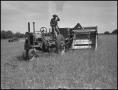 Photograph: [Photograph of a Man on a Tractor]
