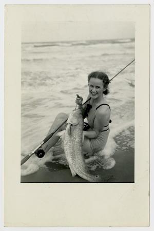 Primary view of object titled '[Woman Holding up a Fish]'.