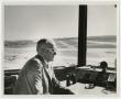 Photograph: [William G. Fuller Sitting at Control Panel]