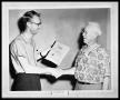 Photograph: Two Men Shaking Hands Holding Algebra Book