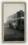 Photograph: [Thurman Maxwell Standing Next to School Bus]