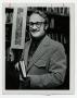 Photograph: [Photograph of Bert Affleck Holding a Book]