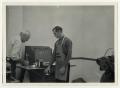 Photograph: [Photograph of Oliver A. Bush Helping Student]