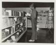 Photograph: [Photograph of Student in McMurry Bookstore]