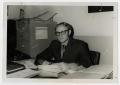 Photograph: [Photograph of Bert Affleck Seated at Desk]