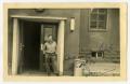 Postcard: [Postcard of Soldier in Doorway]