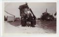 Photograph: [N. C. and Tommy Berndt Working on Cotton Picker]