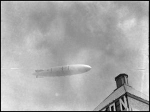 Primary view of object titled '[Dirigible Over a Hilton Hotel]'.