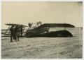 Photograph: [Soldiers Beside an Upside Down Biplane]