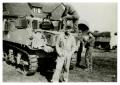 Photograph: [Photograph of Lieutenant Louis I. Dethloff with Soldiers and Tank]