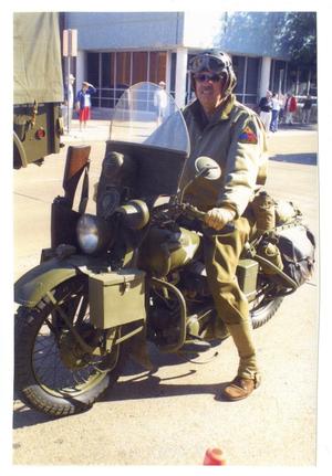 Primary view of object titled '[World War II Motorcycle in Parade]'.