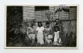 Photograph: [Photograph of Soldier and Filipino Family]
