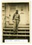 Photograph: [Willaim Beaver Standing on a Porch]