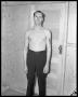 Photograph: Bare chested man standing