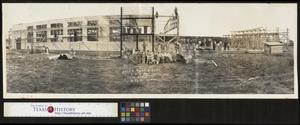 Primary view of object titled 'Photograph of Workers Building Camp Bowie Motor Repair Shop]'.