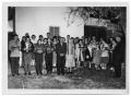Photograph: [Otto Lindig and His Wife with Singing People]