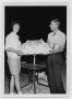 Photograph: [Two People Holding a Birthday Cake]