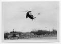 Photograph: [Helicopter Over a Field]