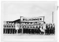 Photograph: [Fredericksburg High School Band with a "Willkommen" Banner]