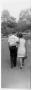 Photograph: [Man and Woman Walk Away from Camera]