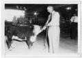 Photograph: [Lyndon Johnson Holding a Calf's Rope]