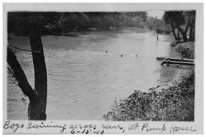 Primary view of object titled 'Boys swimming across river, at pump house'.