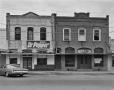 Photograph: [Frank's Place and 2 Story Brick Commercial]