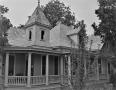 Photograph: [F.P. McLaughlin House, (West oblique showing turret and porch detail…