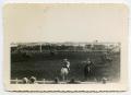 Primary view of [Photograph of Horsemen at a Rodeo]