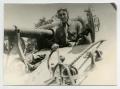 Photograph: [A Soldier Riding in a Tank]