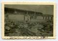Photograph: [Soldiers Standing Over Dead Bodies]