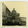 Photograph: [A Soldier Riding on a Tank]