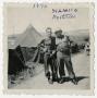 Photograph: [Two German Soldiers in Front of Tents]