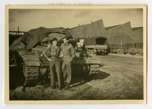 Primary view of object titled '[Two Soldiers Standing in Front of a Tank]'.