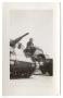 Photograph: [A Soldier Sitting Down on a Tank]