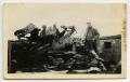 Photograph: [Soldiers Standing Around a Destroyed Gun Emplacement]