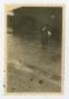 Photograph: [Photograph of a Refugee Walking on a Street]
