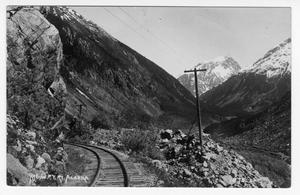 Primary view of object titled '[Postcard of Railroad Track in Alaskan Mountains]'.