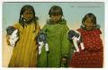 Postcard: [Postcard of Alaska Native Girls with Puppies]