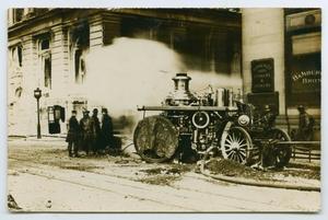 Primary view of object titled '[Postcard with a Photograph of a Fire Engine by a Bank]'.