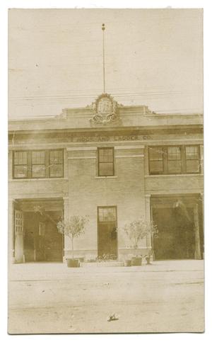 Primary view of object titled '[Photograph of an Old Fire Station with Logo on top]'.