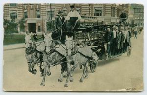 Primary view of object titled '[Postcard of Fire Fighters Driving to a Fire]'.