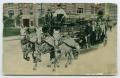 Thumbnail image of item number 1 in: '[Postcard of Fire Fighters Driving to a Fire]'.
