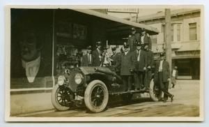 Primary view of object titled '[Postcard with a Photograph of Nine Firemen on Their Fire Truck]'.