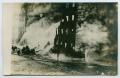 Primary view of [Postcard with a Photograph of a Large Building on Fire]