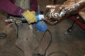 Photograph: [Welding the Hand of a Statue]